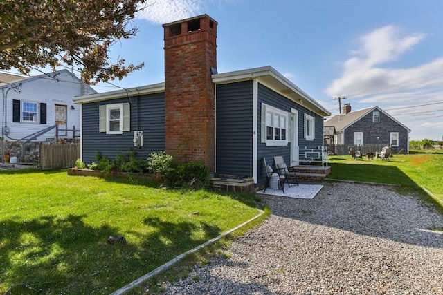 back of property with a chimney