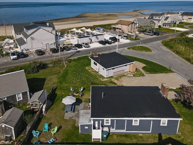 aerial view of residential area with a large body of water