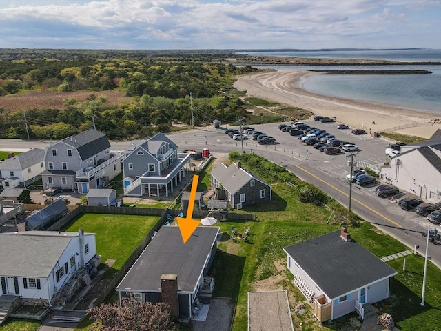 aerial view of residential area with a nearby body of water