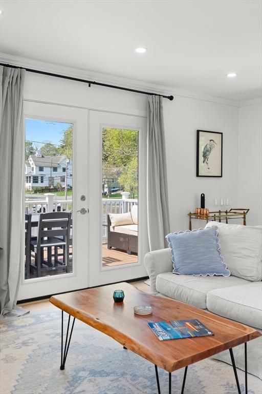 4 Agawam Ave, Ipswich, MA 01938 - living area featuring french doors, healthy amount of natural light, ornamental molding, and recessed lighting