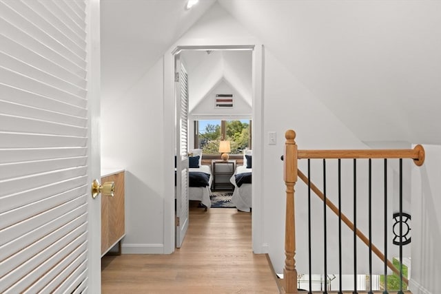 4 Agawam Ave, Ipswich, MA 01938 - hall with an upstairs landing, light wood-style floors, vaulted ceiling, and baseboards