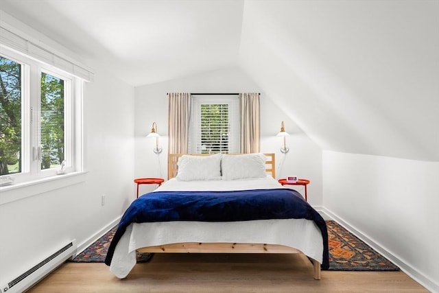 4 Agawam Ave, Ipswich, MA 01938 - bedroom with a baseboard heating unit, vaulted ceiling, wood finished floors, and baseboards