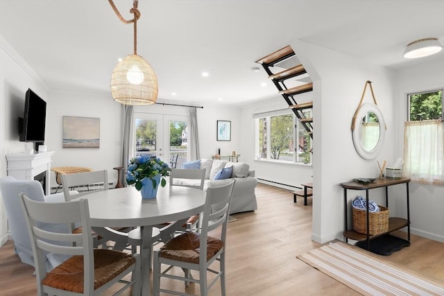 4 Agawam Ave, Ipswich, MA 01938 - dining area with light wood-type flooring, a baseboard radiator, recessed lighting, crown molding, and french doors