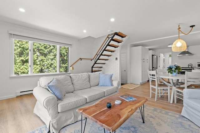 4 Agawam Ave, Ipswich, MA 01938 - living room featuring a baseboard radiator, stairway, light wood-type flooring, baseboards, and recessed lighting