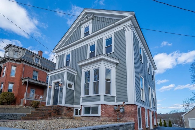 view of front of house featuring brick siding