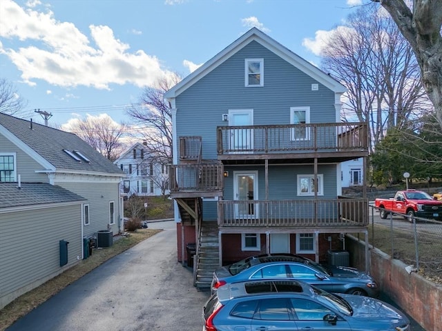 exterior space featuring central AC and stairway