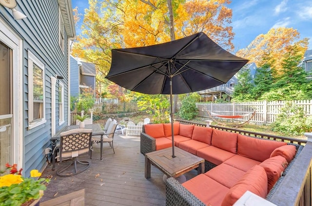 wooden terrace featuring an outdoor hangout area