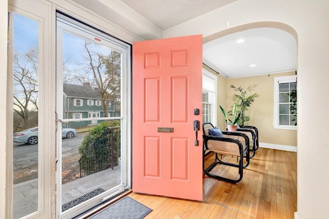 foyer entrance with light hardwood / wood-style floors