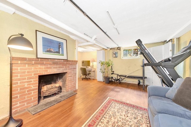 living room featuring a fireplace and hardwood / wood-style floors