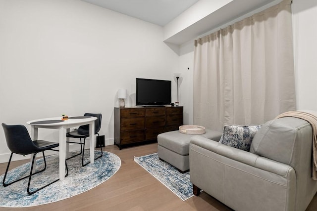121 Portland St Unit 505, Boston, MA 02114 - living area featuring wood finished floors and baseboards