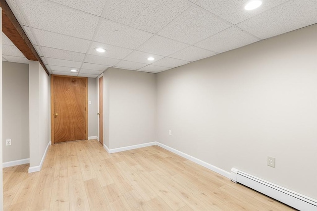 unfurnished room with recessed lighting, light wood-style floors, baseboards, and baseboard heating