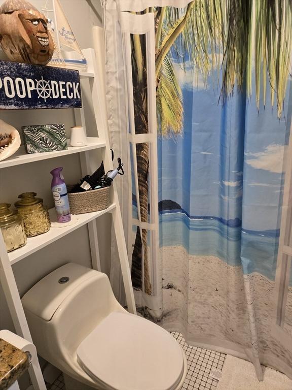 bathroom featuring a shower with curtain