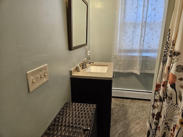 16 Boyd Ave, East Providence, RI 02914 - full bath with a baseboard heating unit, vanity, and a textured wall