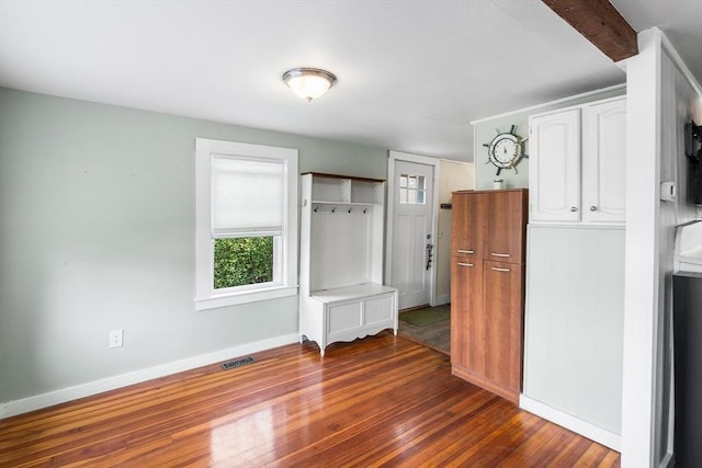 134 Hampton Cir, Hull, MA 02045 - unfurnished dining area with dark wood-style flooring and baseboards