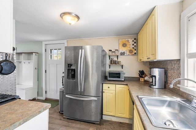 134 Hampton Cir, Hull, MA 02045 - kitchen featuring stainless steel refrigerator with ice dispenser, a sink, backsplash, and dark wood finished floors