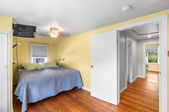 134 Hampton Cir, Hull, MA 02045 - bedroom featuring attic access, wood finished floors, and baseboards