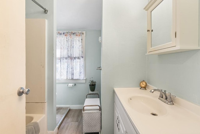 134 Hampton Cir, Hull, MA 02045 - bathroom featuring vanity, wood finished floors, and baseboards