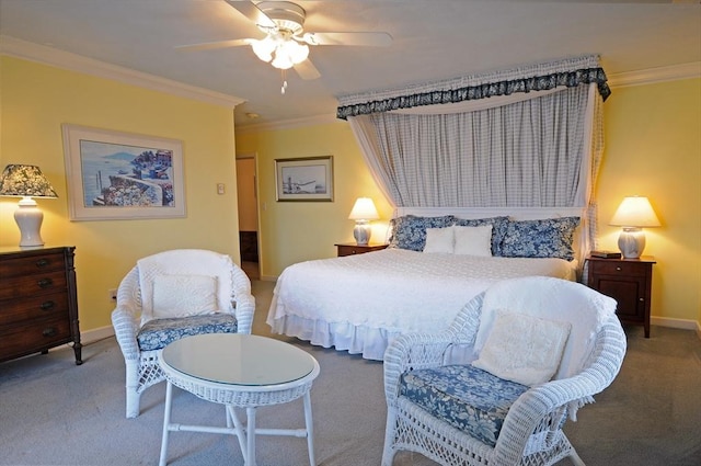 carpeted bedroom featuring ceiling fan, baseboards, and crown molding