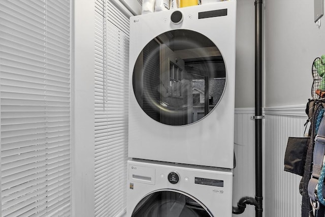 laundry area with stacked washer / dryer