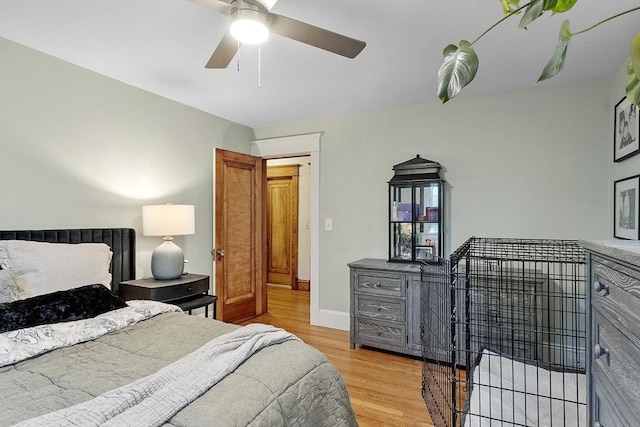 bedroom featuring ceiling fan and light hardwood / wood-style flooring