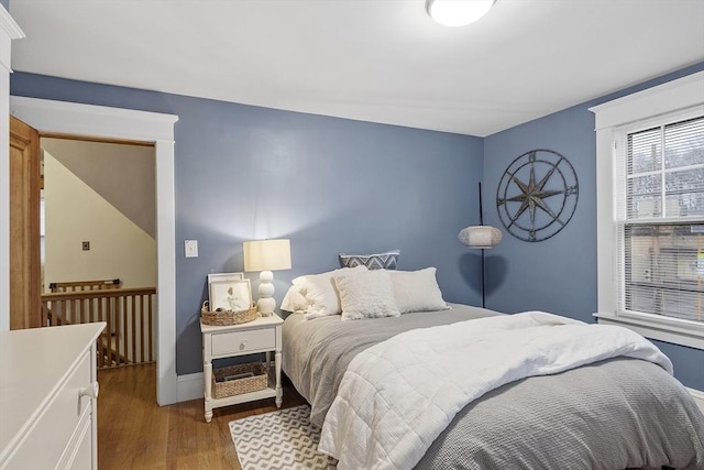 bedroom with wood-type flooring