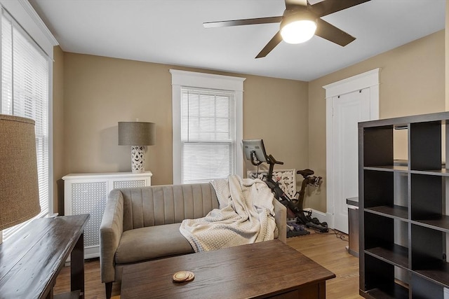 interior space with light wood-type flooring and ceiling fan