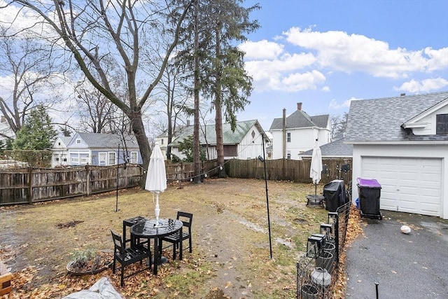 view of yard with a garage