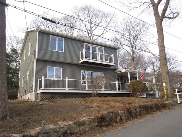 view of front of property with a balcony