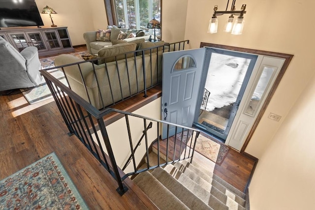 stairs with wood-type flooring