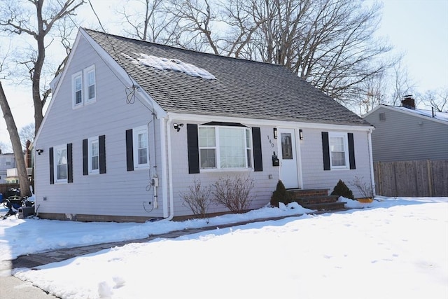 view of front of property featuring a shingled roof