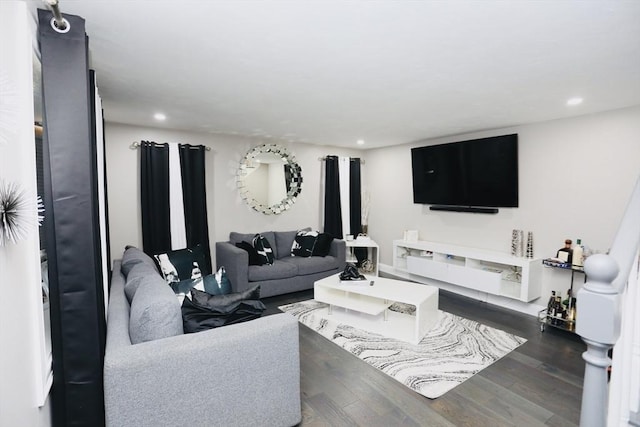 living area featuring dark wood-type flooring and recessed lighting