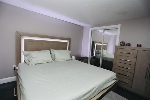 bedroom featuring a closet and baseboards