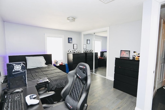 bedroom featuring a closet and wood finished floors