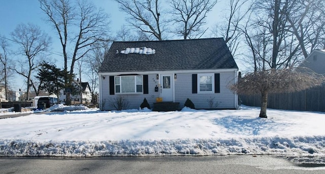 cape cod home with entry steps and roof with shingles