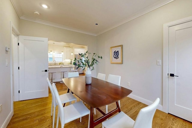 30 Pembroke St, Somerville, MA 02145 - dining space featuring ornamental molding, light wood-style flooring, baseboards, and recessed lighting