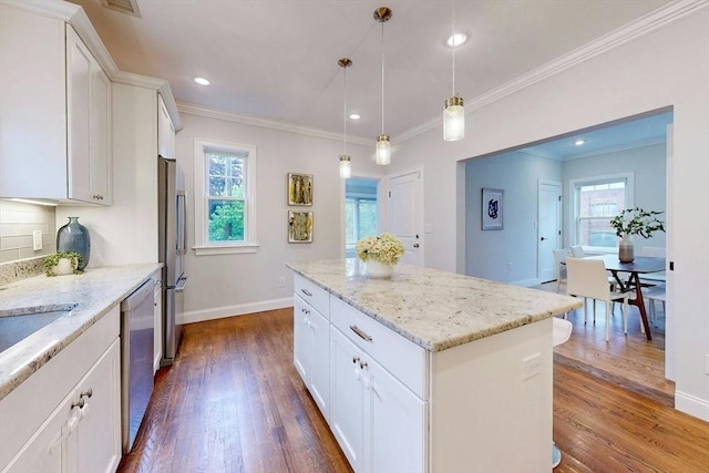 30 Pembroke St, Somerville, MA 02145 - kitchen with stainless steel appliances, dark wood-style flooring, white cabinetry, baseboards, and ornamental molding