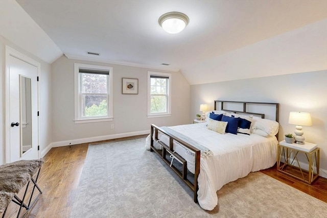 30 Pembroke St, Somerville, MA 02145 - bedroom with wood finished floors, lofted ceiling, and baseboards