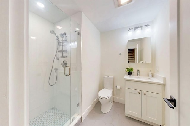 30 Pembroke St, Somerville, MA 02145 - bathroom featuring a shower stall, toilet, tile patterned floors, vanity, and baseboards