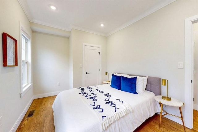 30 Pembroke St, Somerville, MA 02145 - bedroom featuring ornamental molding, wood finished floors, baseboards, multiple windows, and recessed lighting