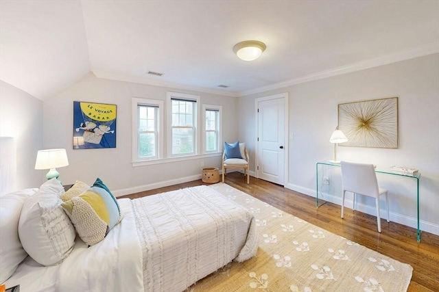 30 Pembroke St, Somerville, MA 02145 - bedroom featuring wood finished floors, baseboards, crown molding, and lofted ceiling