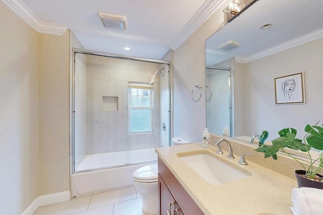 30 Pembroke St, Somerville, MA 02145 - bathroom with double vanity, tile patterned floors, toilet, shower / bath combination with glass door, and crown molding