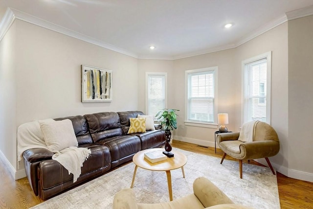 30 Pembroke St, Somerville, MA 02145 - living area with light wood-style flooring, baseboards, crown molding, and recessed lighting