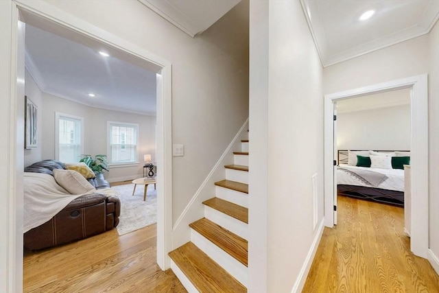 30 Pembroke St, Somerville, MA 02145 - stairs featuring ornamental molding, wood finished floors, baseboards, and recessed lighting