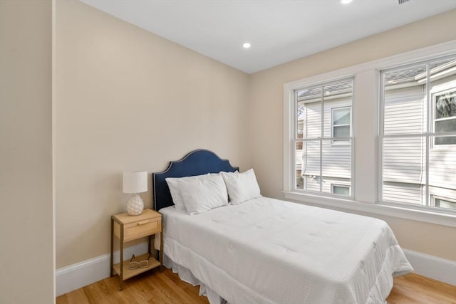 21 Francis St Unit 21, Newton, MA 02459 - bedroom featuring baseboards, light wood-style flooring, multiple windows, and recessed lighting