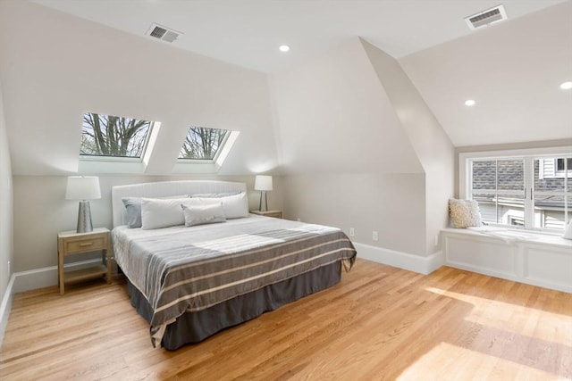21 Francis St Unit 21, Newton, MA 02459 - bedroom featuring vaulted ceiling, baseboards, wood finished floors, a skylight, and recessed lighting