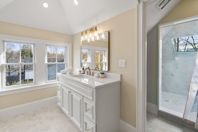 21 Francis St Unit 21, Newton, MA 02459 - bathroom with healthy amount of natural light, baseboards, lofted ceiling, a chandelier, and recessed lighting