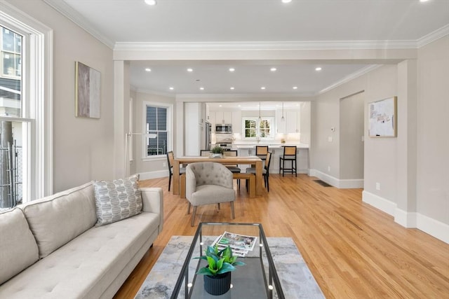 21 Francis St Unit 21, Newton, MA 02459 - living area with baseboards, light wood-style floors, recessed lighting, and ornamental molding