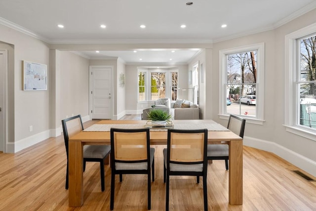 21 Francis St Unit 21, Newton, MA 02459 - dining area featuring healthy amount of natural light, light wood finished floors, crown molding, baseboards, and recessed lighting