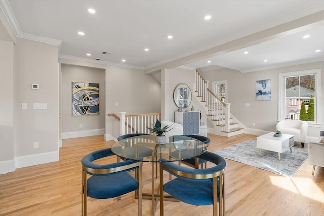 21 Francis St Unit 21, Newton, MA 02459 - dining area with baseboards, recessed lighting, crown molding, light wood finished floors, and stairway