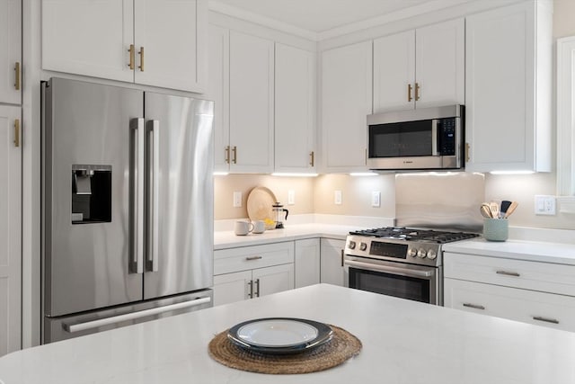21 Francis St Unit 21, Newton, MA 02459 - kitchen featuring appliances with stainless steel finishes, light countertops, and white cabinets